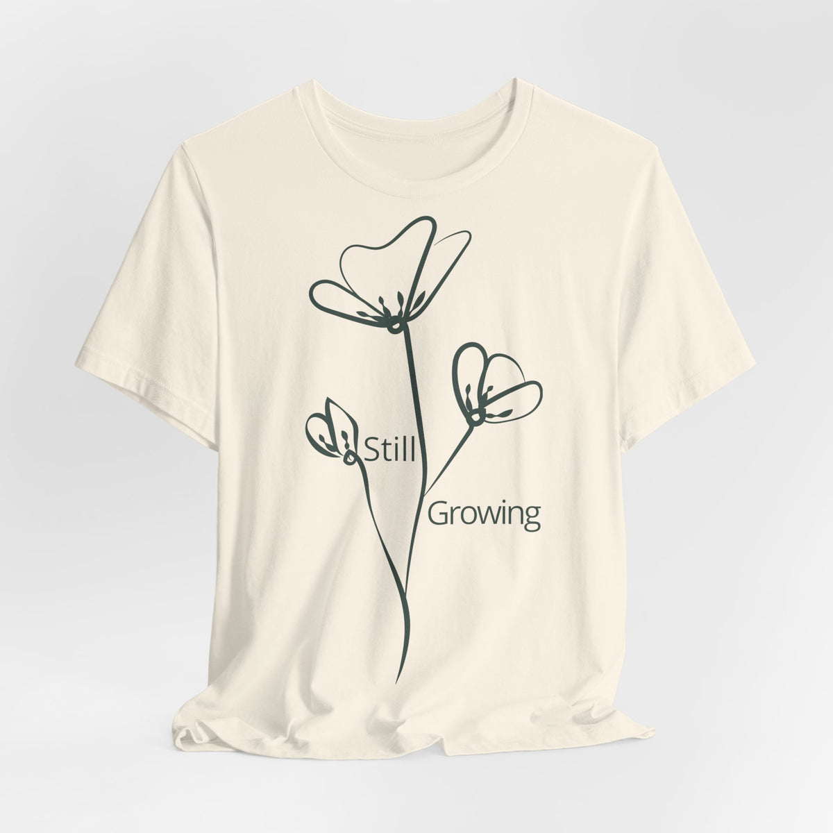 Still Growing Floral T-Shirt by Printify featuring a minimalist floral design on a comfortable casual tee.
