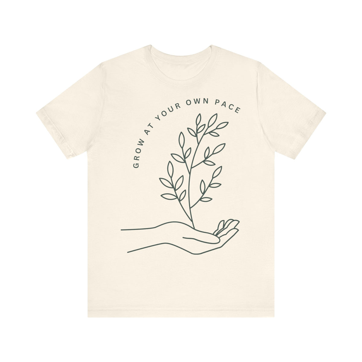 Minimal botanical print T-shirt from Printify featuring the message "Grow At Your Own Pace" on soft fabric.