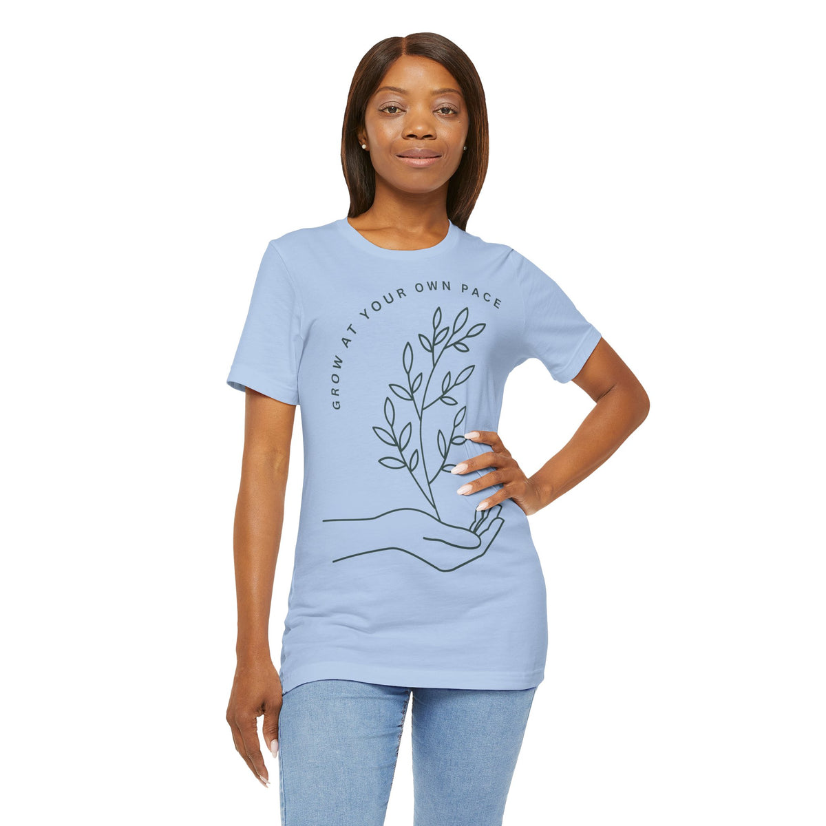Minimal botanical Printify T-shirt featuring "Grow At Your Own Pace" slogan on soft fabric, ideal for casual wear.