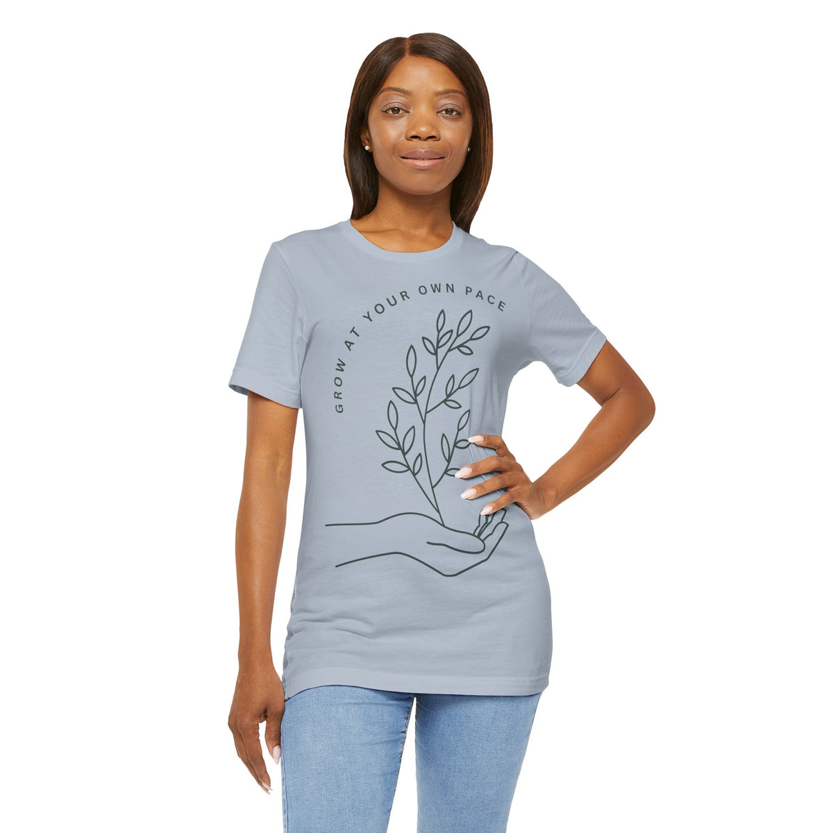 Minimal botanical print T-shirt by Printify featuring the phrase "Grow At Your Own Pace" on a casual cotton tee.