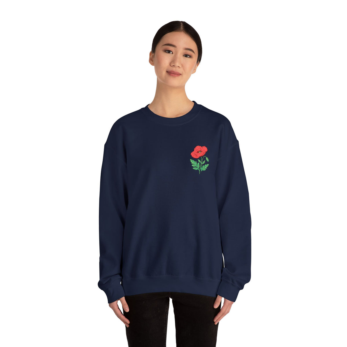 Unisex embroidered sweatshirt with floral poppy design on the left chest, featuring comfortable fabric and casual style.