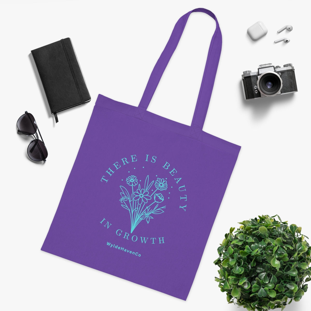 Eco-friendly floral cotton tote bag with inspirational "There Is Beauty In Growth" print, designed by Printify.