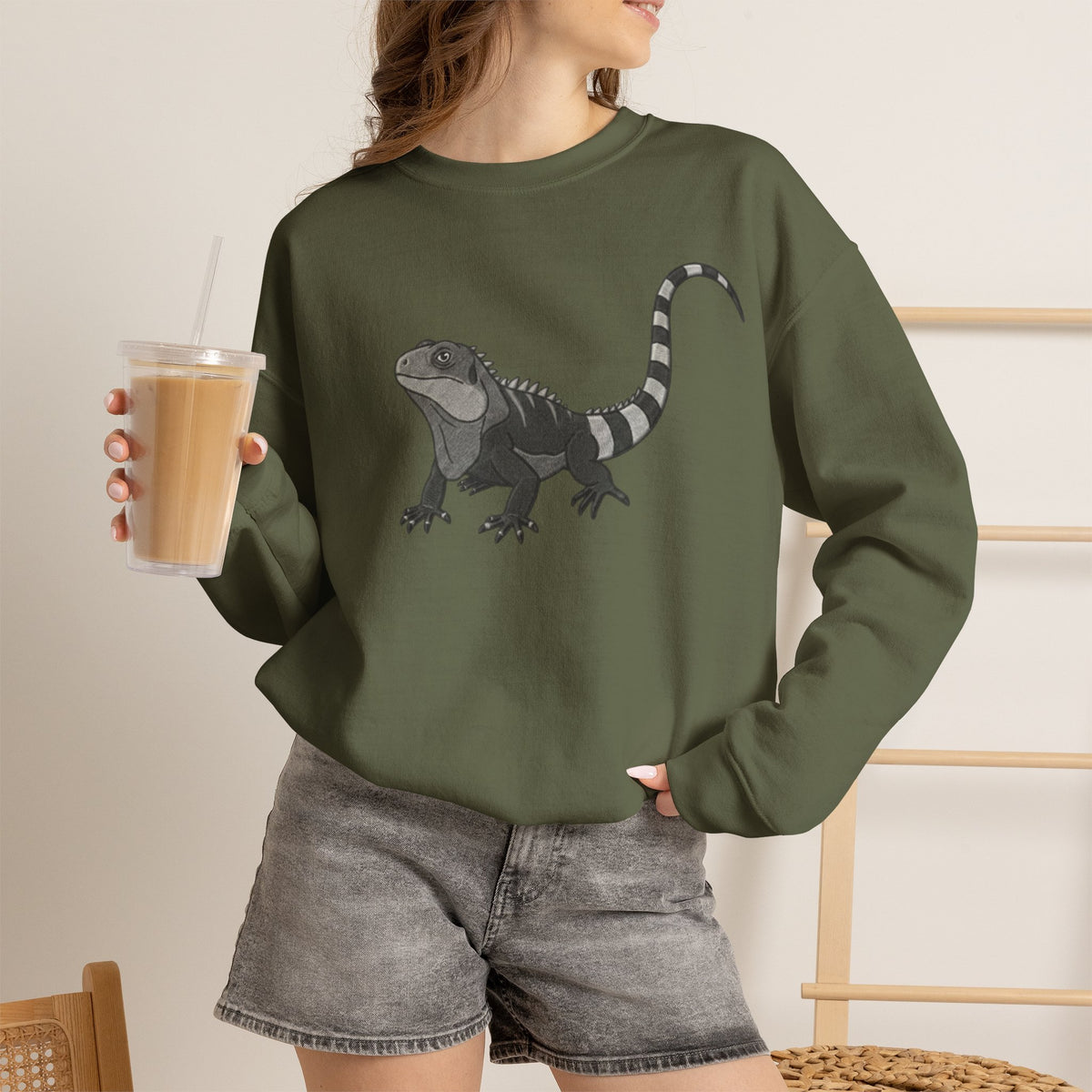 Iguana graphic sweatshirt from Wyldelife Collection by Printify featuring a colorful reptile illustration on soft fabric.