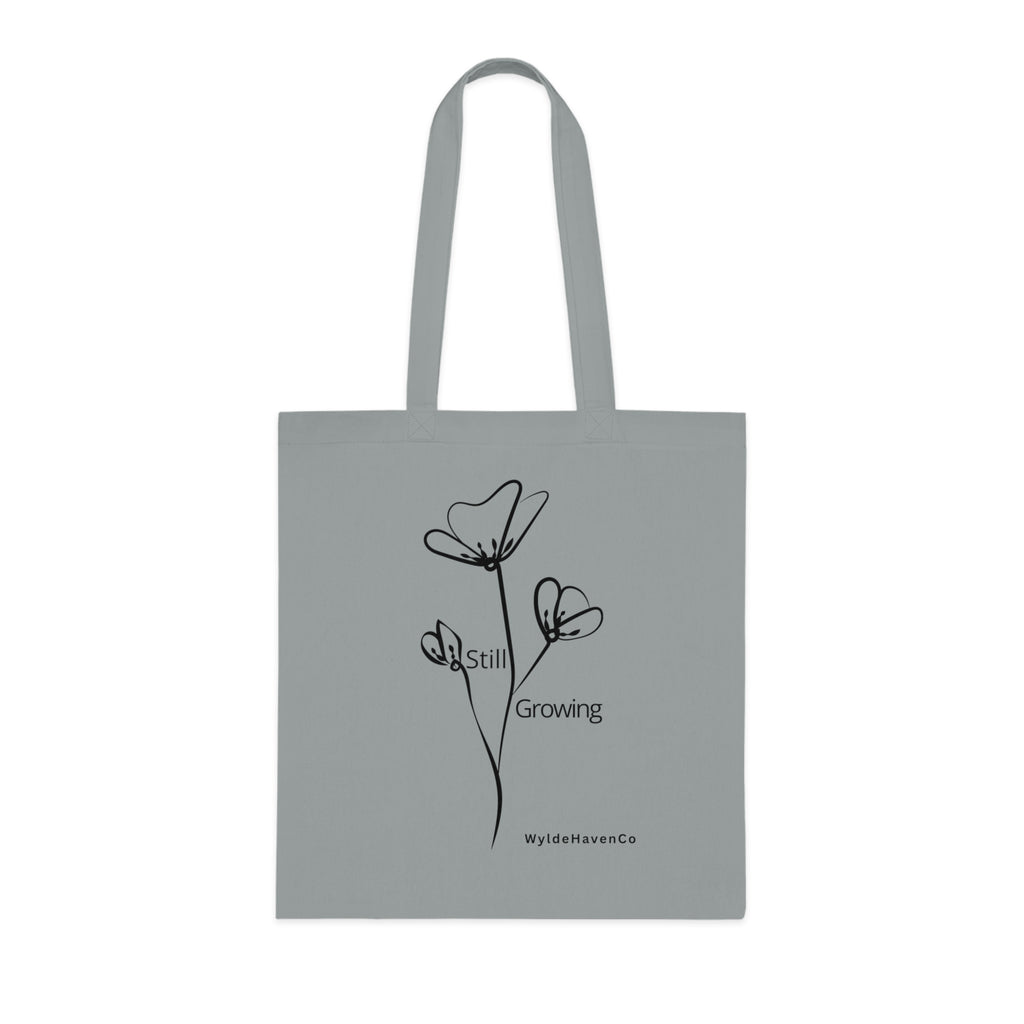 Still Growing floral cotton tote bag by Printify featuring a minimalist inspirational design and durable fabric.