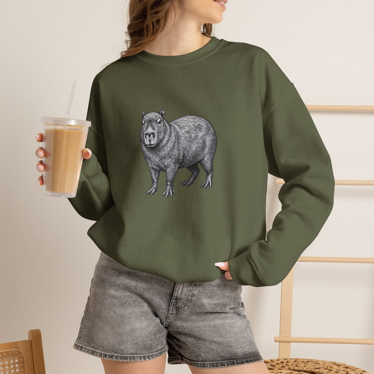 Capybara graphic sweatshirt from Wyldelife Collection featuring wildlife art on a comfortable Printify sweatshirt.