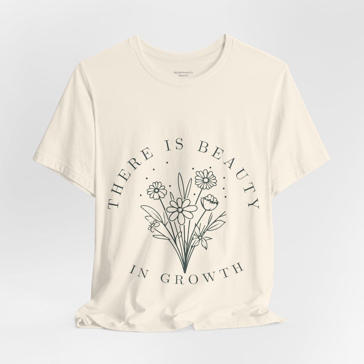 Printify floral T-shirt featuring a colorful "There Is Beauty In Growth" design on soft fabric, front view.