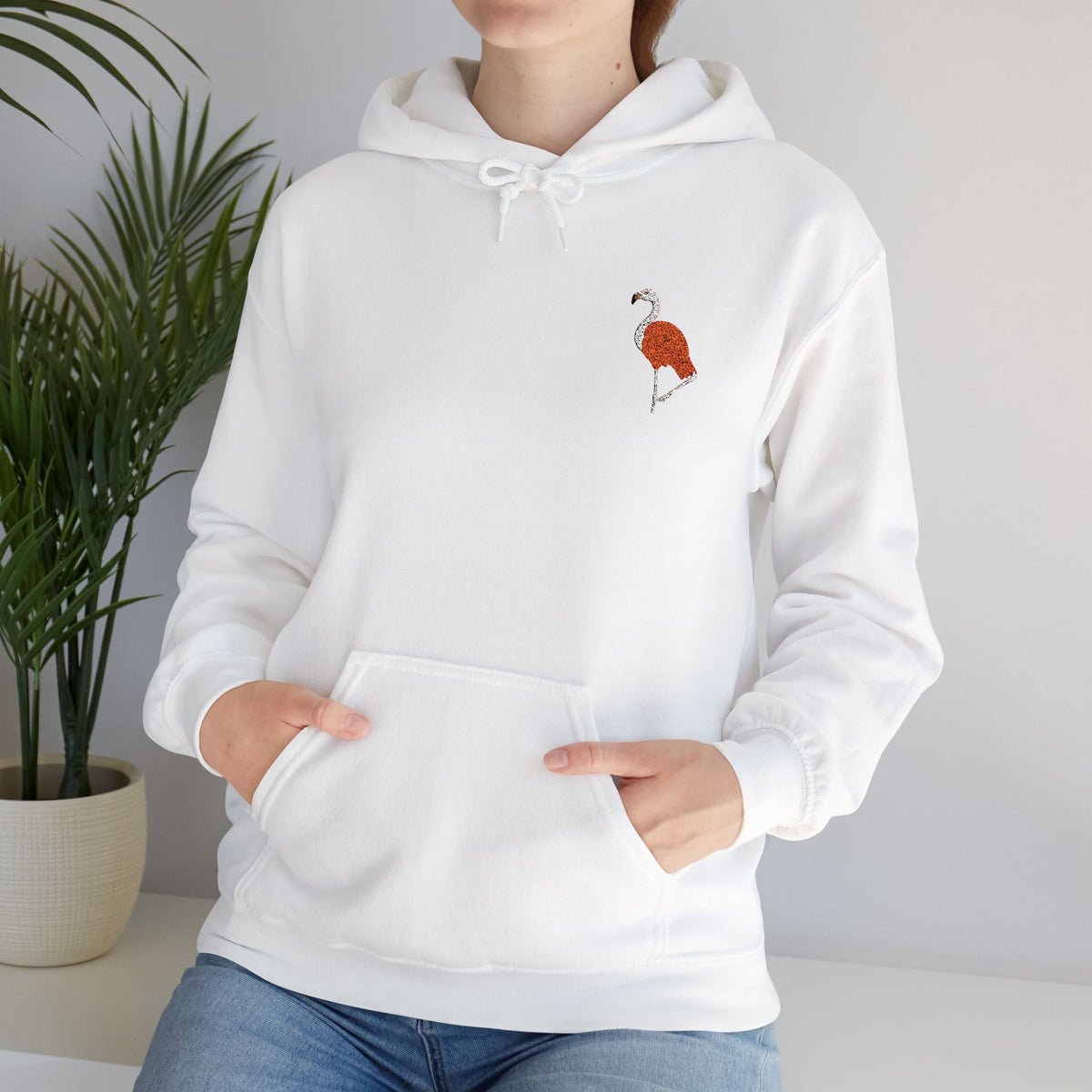 Pink flamingo embroidered hoodie from Wyldelife Collection, featuring wildlife embroidery on a premium unisex hoodie by Printify.