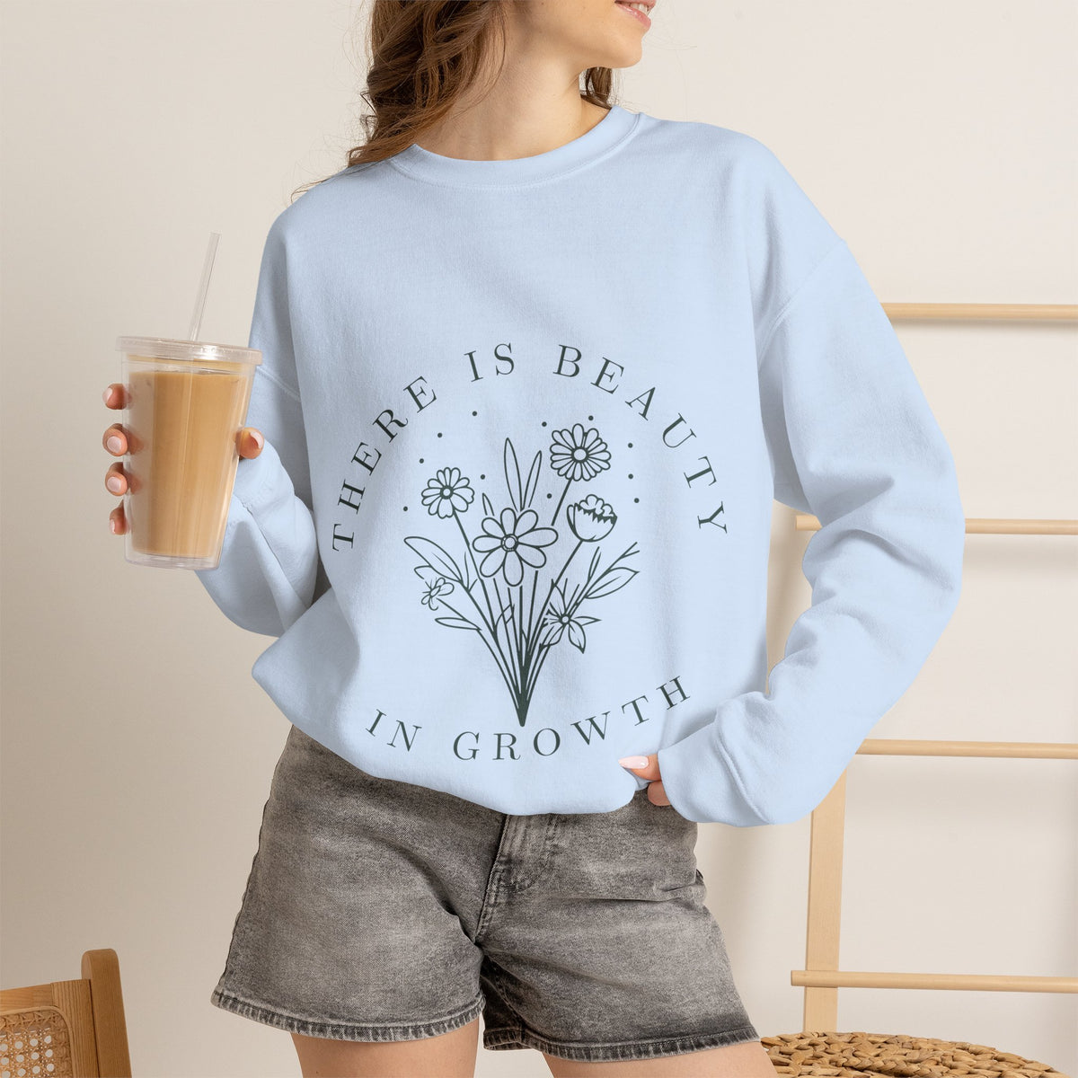 Printify crewneck sweatshirt with "There Is Beauty in Growth" floral minimalist design, soft fabric and comfortable fit.