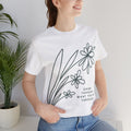 Floral graphic T-shirt with inspirational quote "Grow Through What You Go Through" by Printify, casual fashion tee.