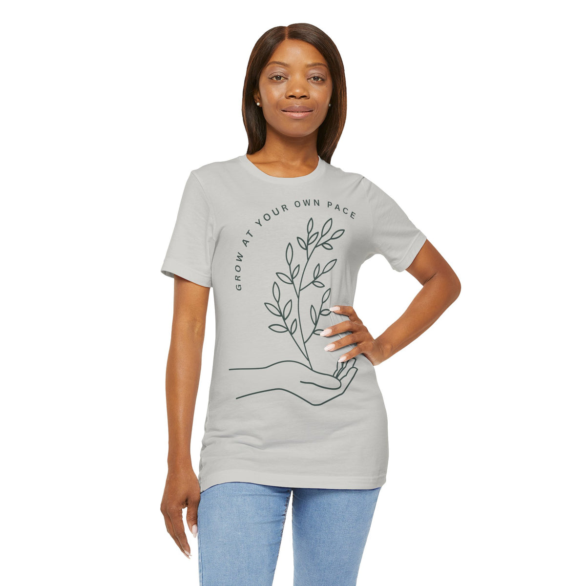 Minimal botanical print T-shirt with "Grow At Your Own Pace" slogan by Printify, featuring a simple green plant design.