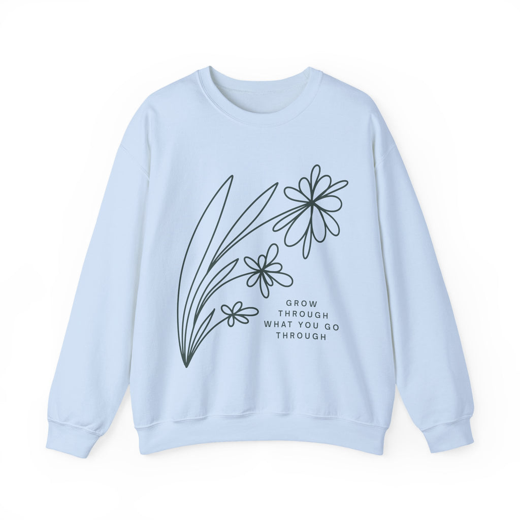 Gray crewneck sweatshirt from Printify featuring a minimal floral design and the quote "Grow Through What You Go Through".