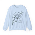 Gray crewneck sweatshirt from Printify featuring a minimal floral design and the quote "Grow Through What You Go Through".
