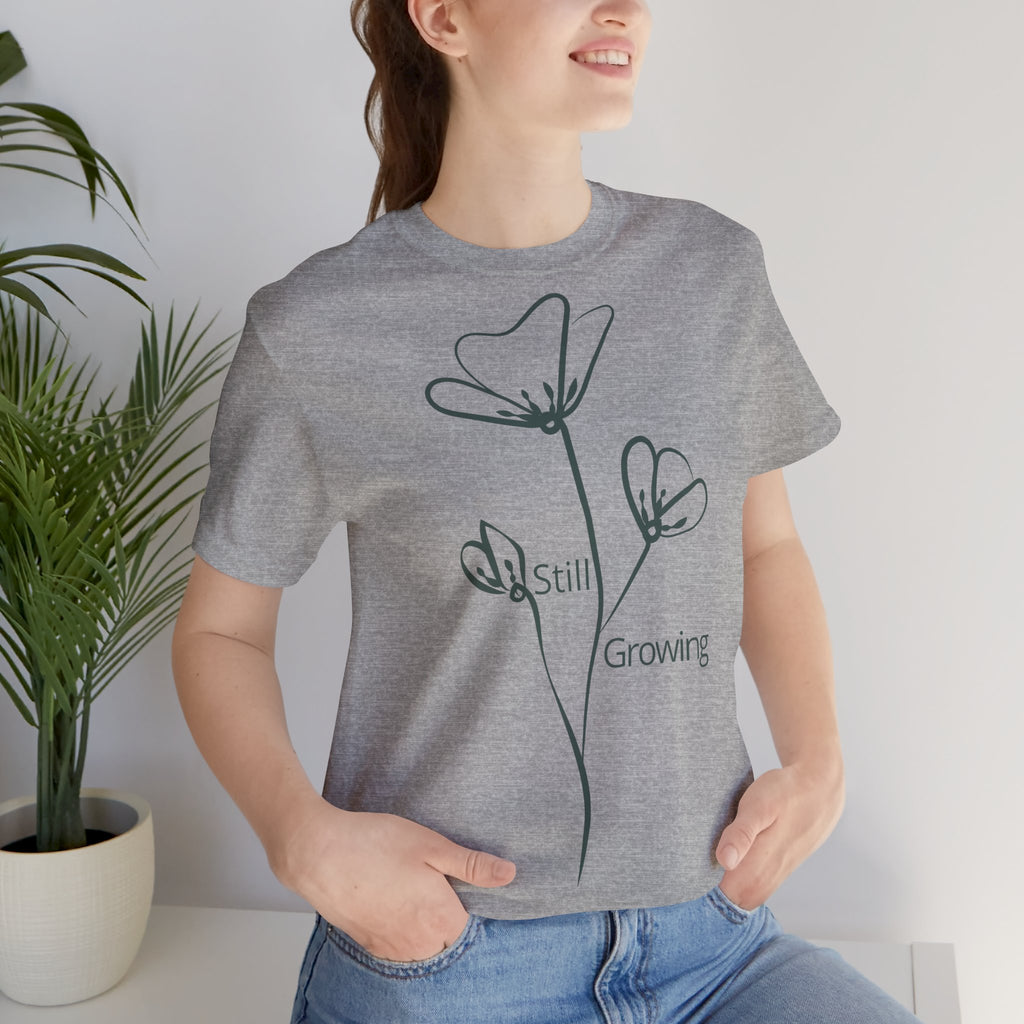 Still Growing Floral T-Shirt by Printify featuring a minimalist floral design on a comfortable casual T-shirt.