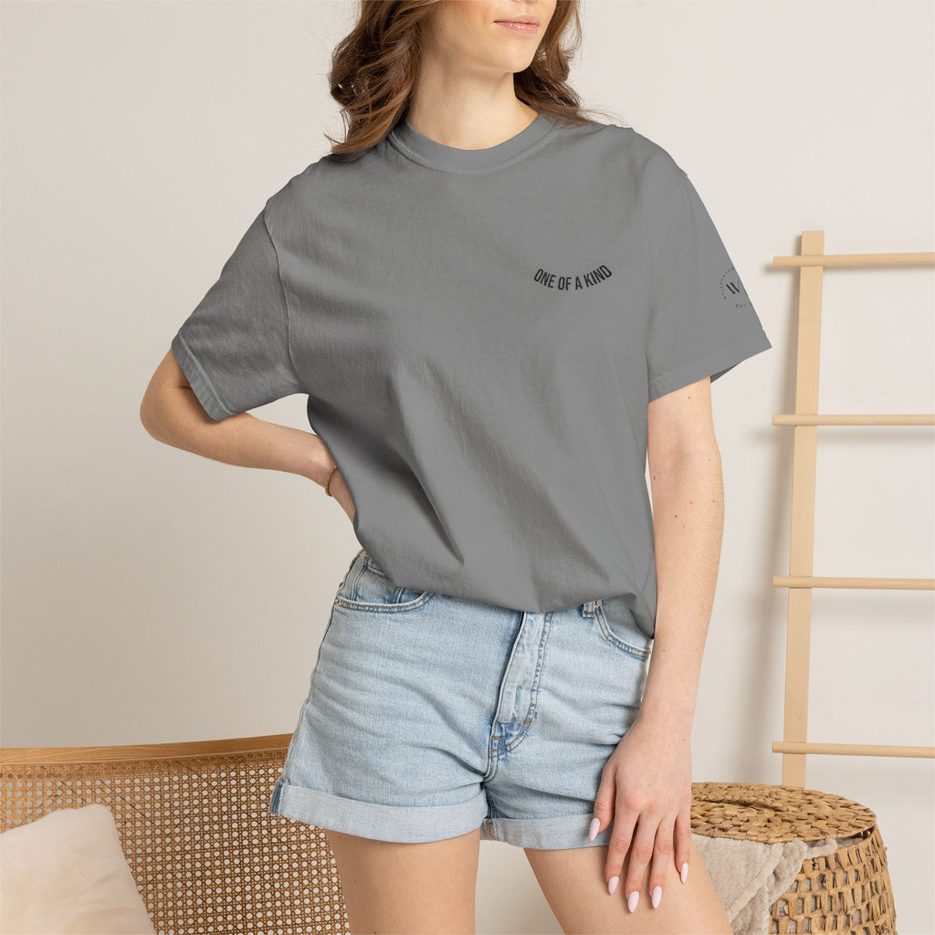 Black "One of a Kind" chest logo T-shirt by Printify featuring a minimalist design on soft cotton fabric.