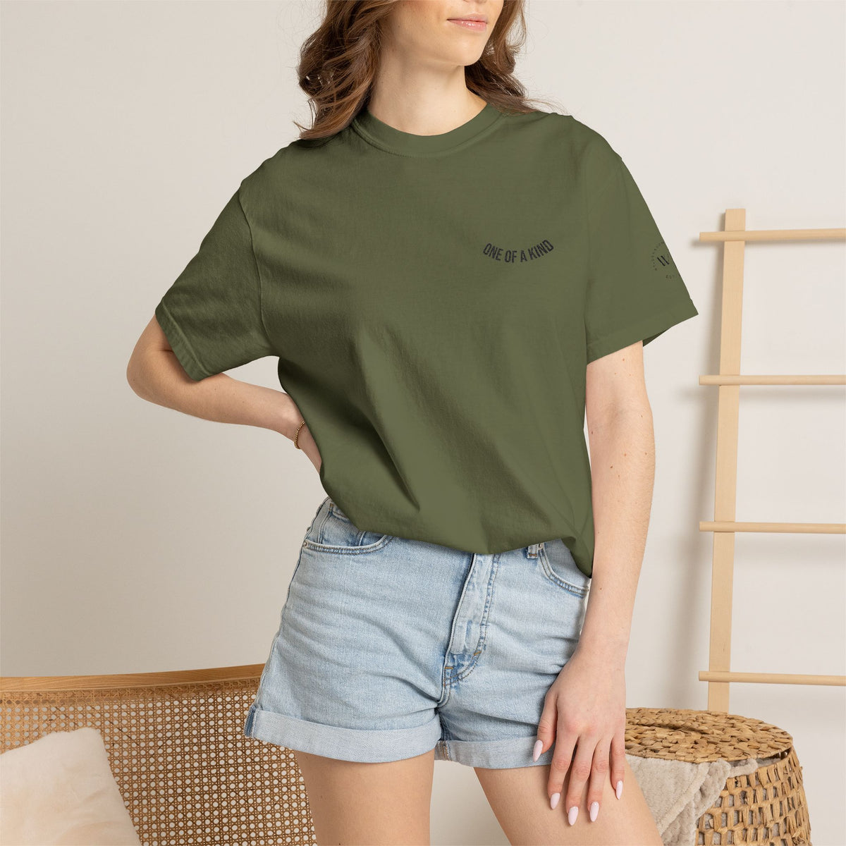Black T-Shirt featuring a "One of a Kind" Chest Logo by Printify, with a casual fit and printed graphic on the front.