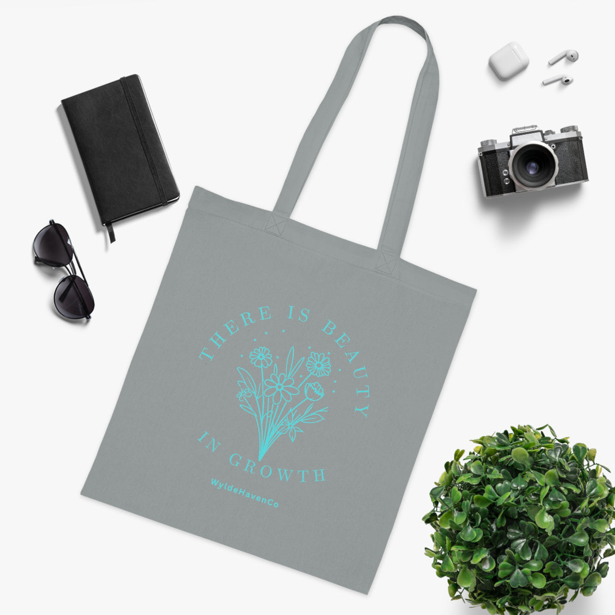 Floral cotton tote bag with "There Is Beauty In Growth" inspirational message, eco-friendly reusable bag by Printify.