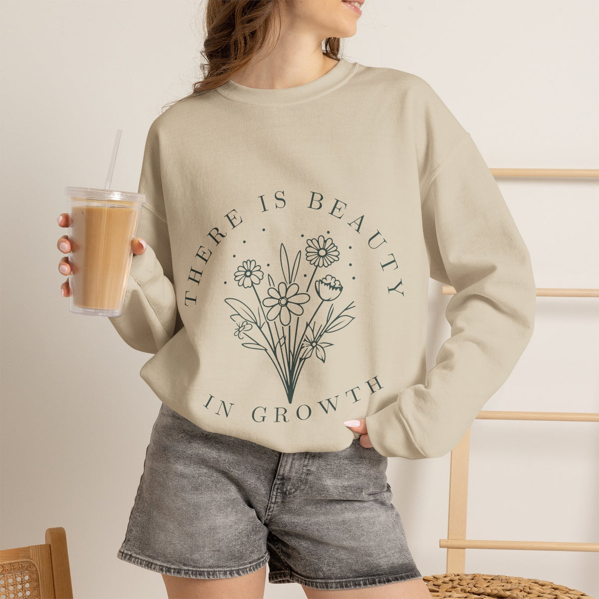 Printify crewneck sweatshirt with "There Is Beauty in Growth" floral minimalist design, soft fabric, and comfortable fit.