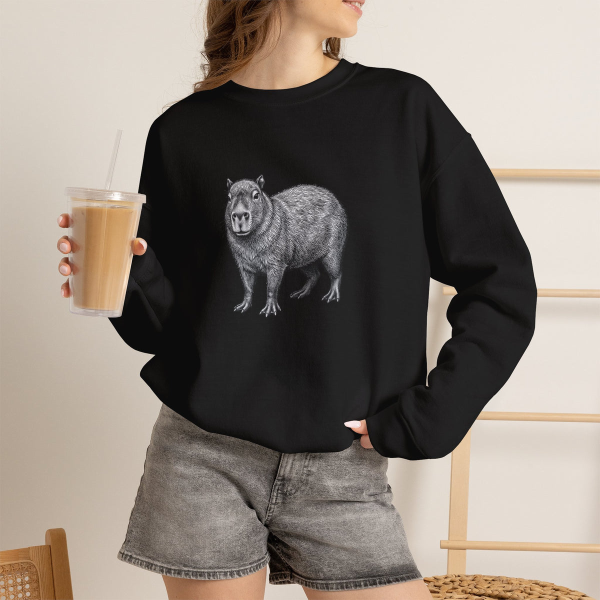 Capybara graphic sweatshirt from Wyldelife Collection by Printify featuring original wildlife art on a cozy sweatshirt.