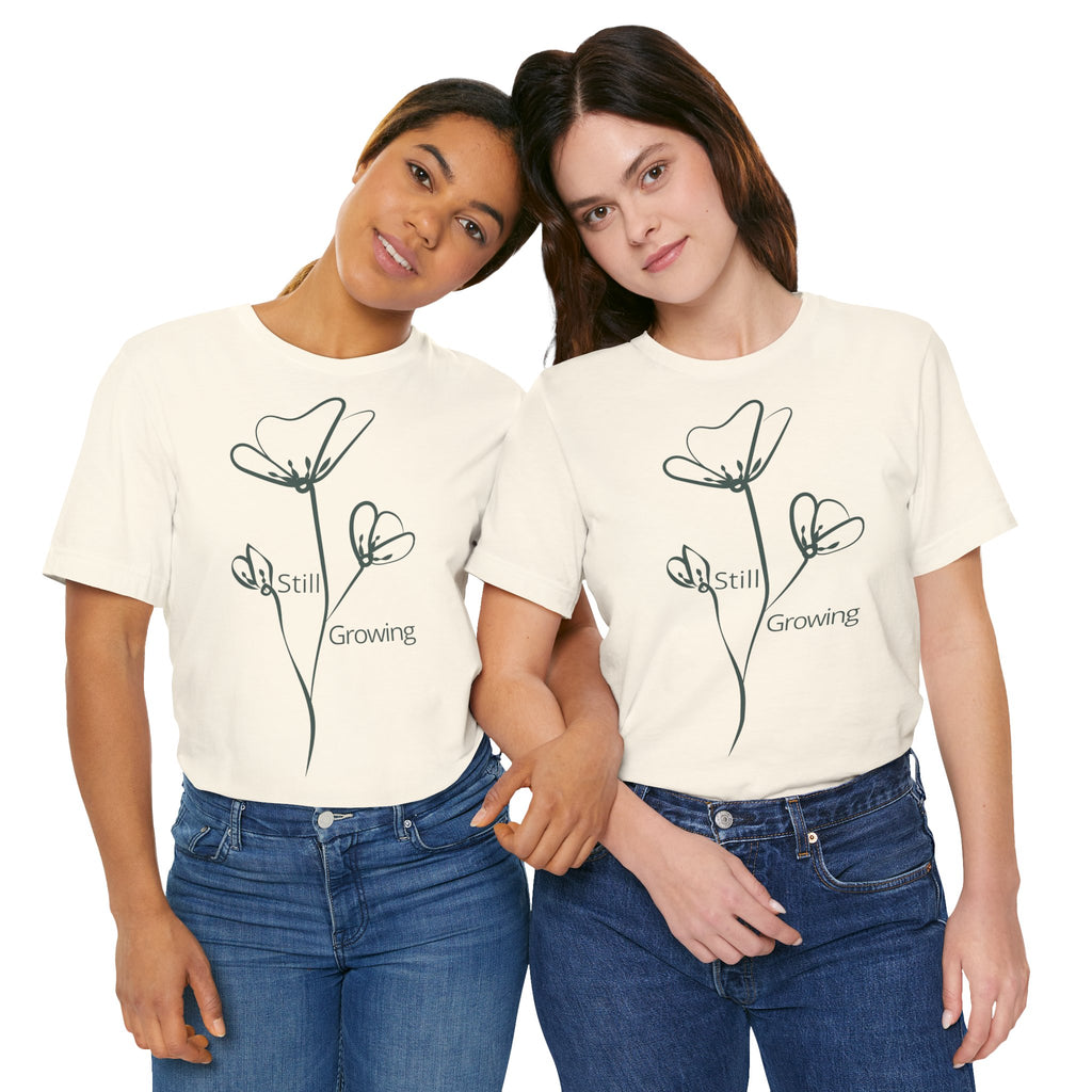 Still Growing Floral T-Shirt by Printify featuring a minimalist floral design on a casual inspirational tee.