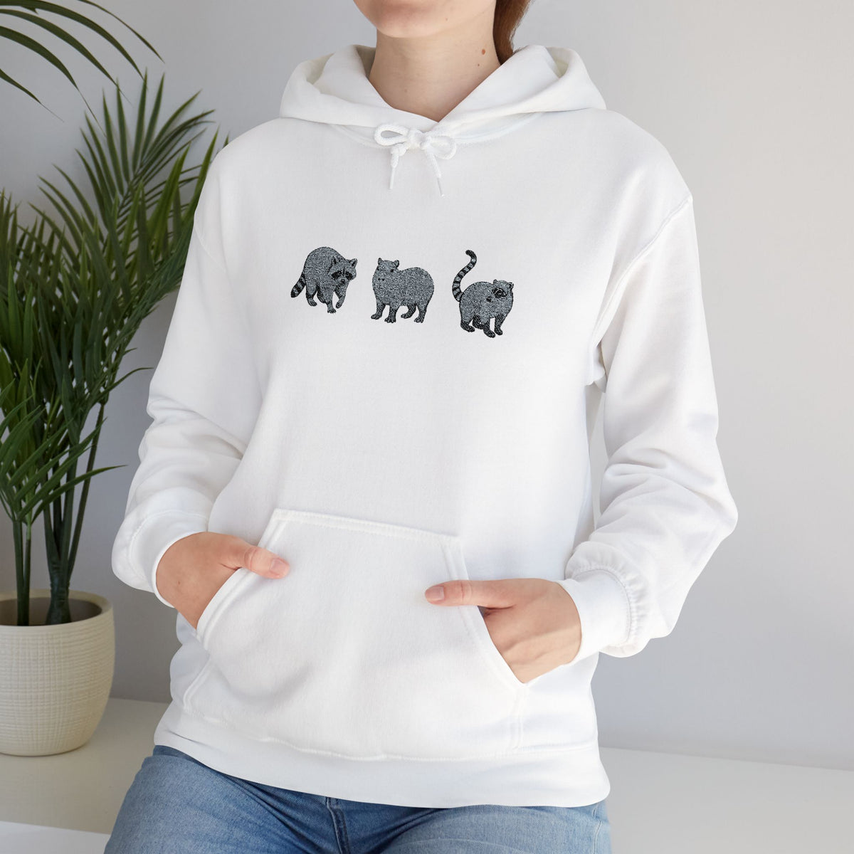Wyldelife Trio embroidered hoodie by Printify featuring raccoon, capybara, and coati designs on a cozy hoodie.