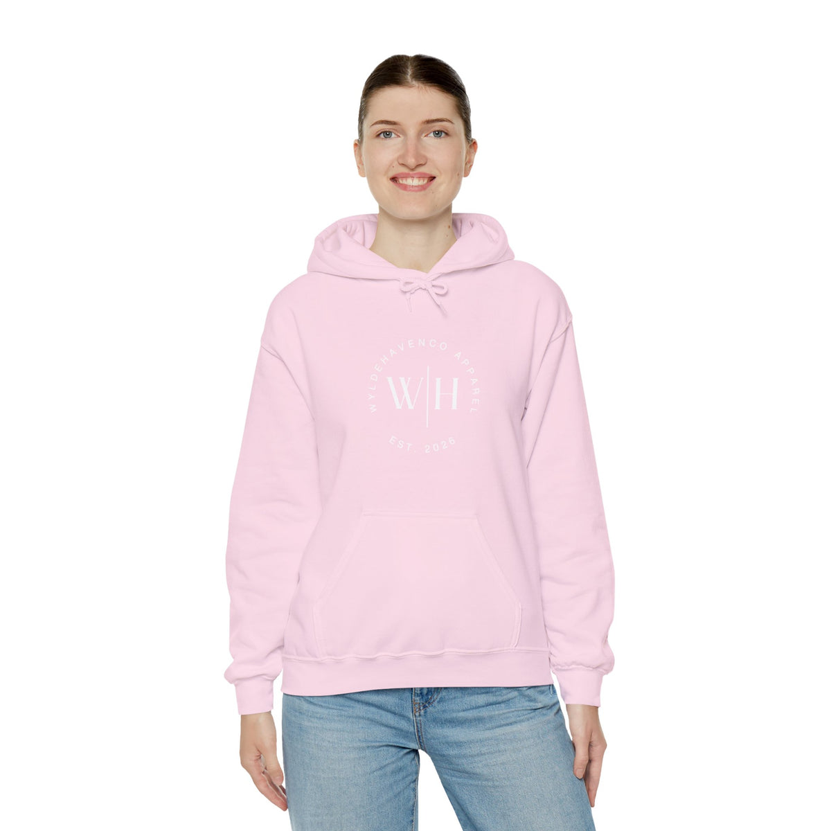 Gray hoodie featuring a monogram circle WYLDHaven Apparel logo design on the front, casual sweatshirt with printed branding.