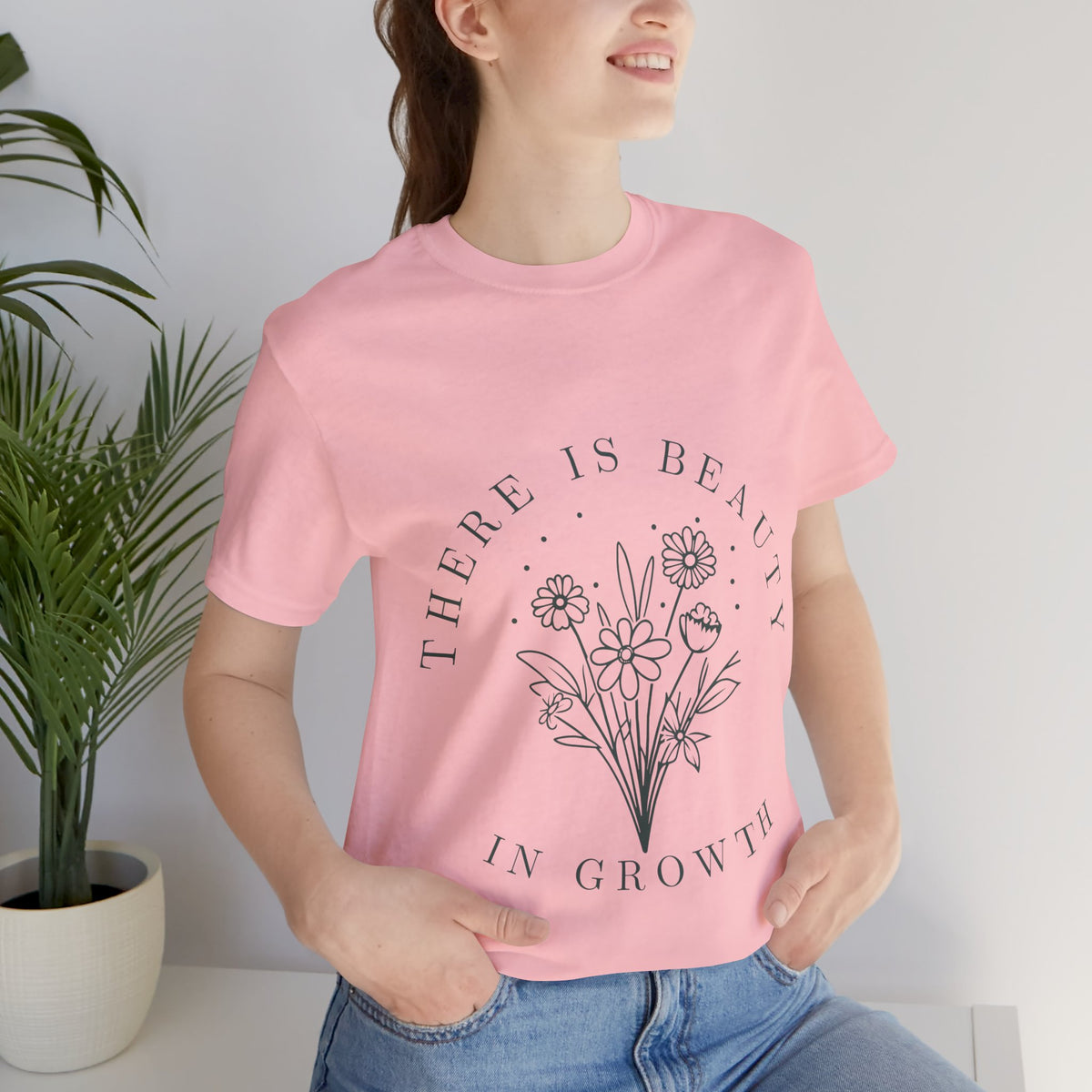 Printify floral T-shirt featuring "There Is Beauty In Growth" design, soft fabric, and vibrant floral print on front.