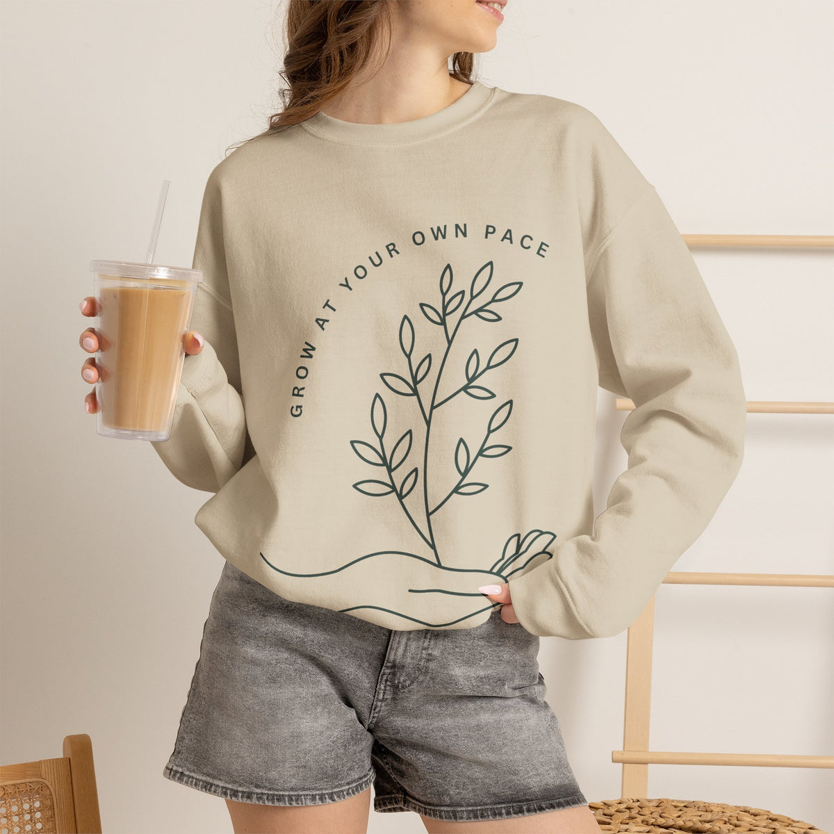 Printify Grow At Your Own Pace crewneck sweatshirt with minimalist line art design, soft fabric and casual fit.