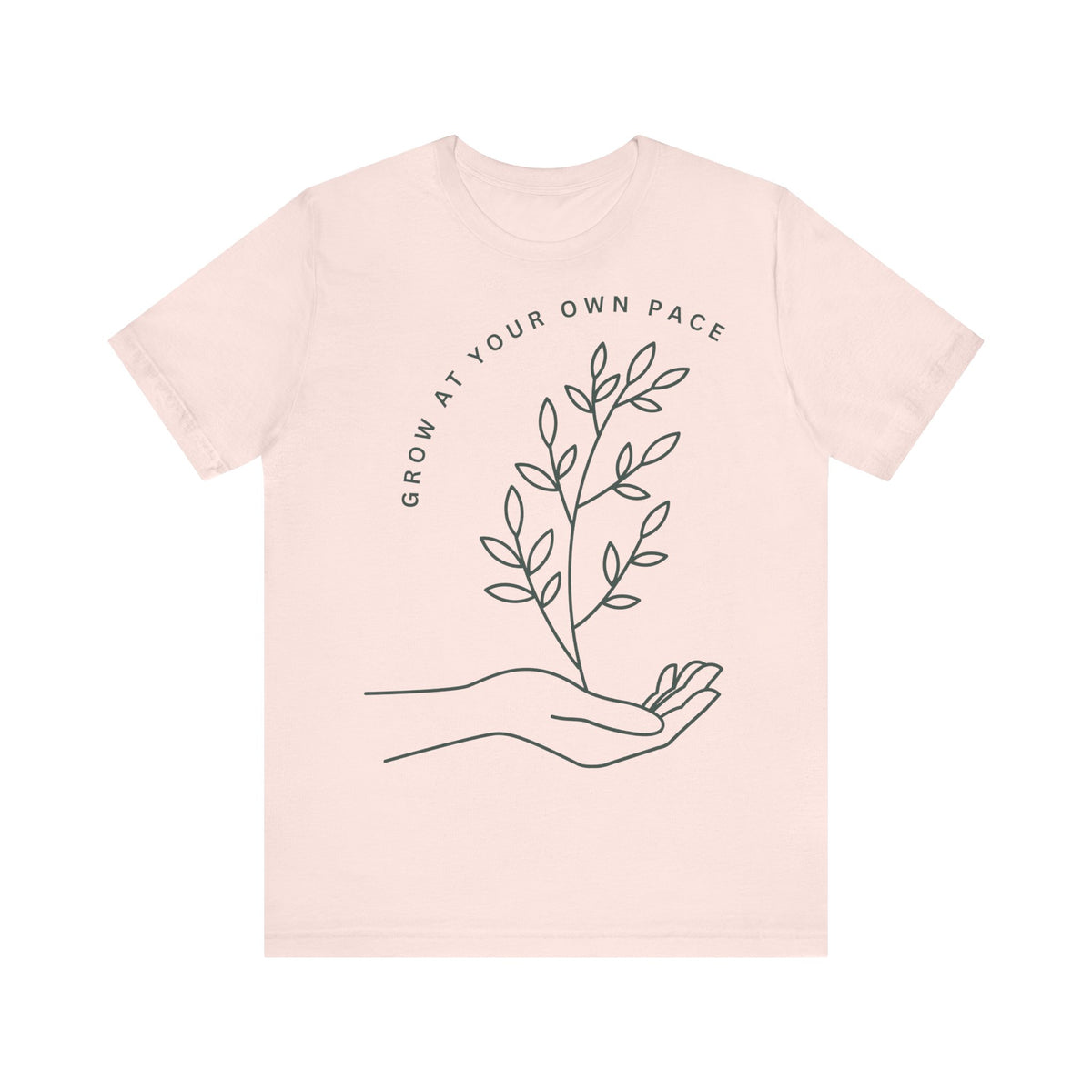 Minimal botanical print T-shirt by Printify featuring "Grow At Your Own Pace" text on a soft fabric tee.