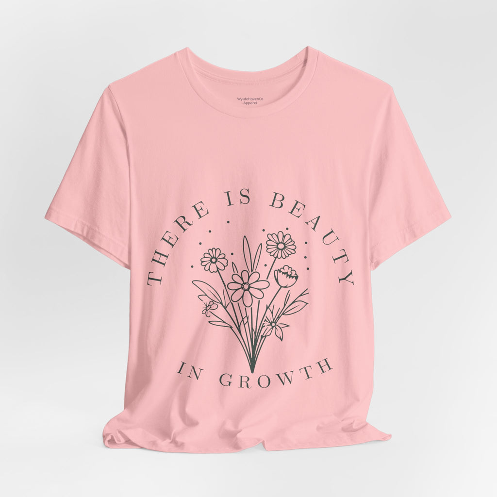 Printify floral T-shirt featuring colorful "There Is Beauty In Growth" design on soft fabric, casual and stylish for everyday wear.