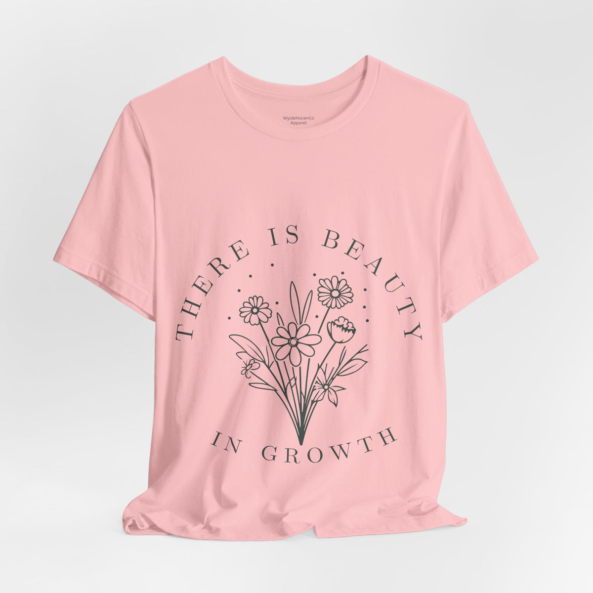 Printify floral T-shirt featuring colorful "There Is Beauty In Growth" design on soft fabric, casual and stylish for everyday wear.