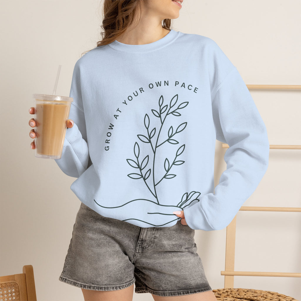 Printify Grow At Your Own Pace crewneck sweatshirt featuring minimalist line art on soft, comfortable fabric.