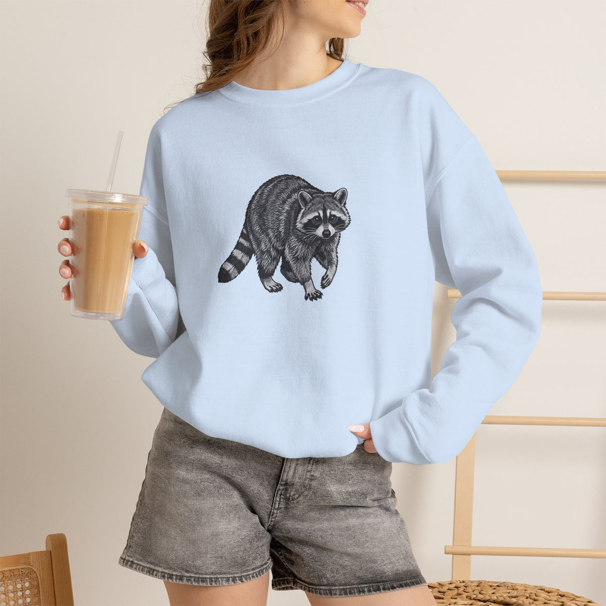 Raccoon graphic sweatshirt from Wyldelife Collection by Printify, featuring wildlife art design in soft fabric.