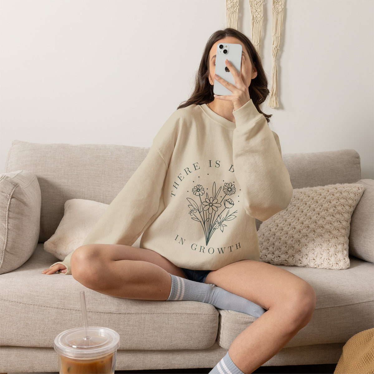 Printify crewneck sweatshirt featuring a floral minimalist design with the phrase "There Is Beauty in Growth" on a soft fabric.