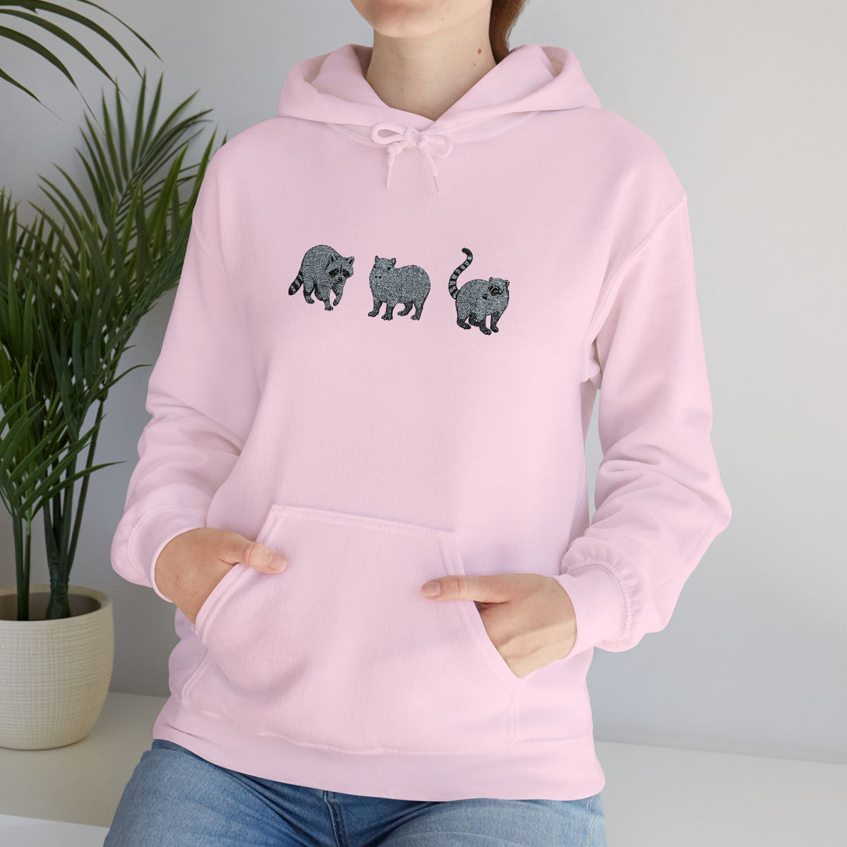 Wyldelife Trio embroidered hoodie by Printify featuring raccoon, capybara, and coati animal designs on a cozy hoodie.