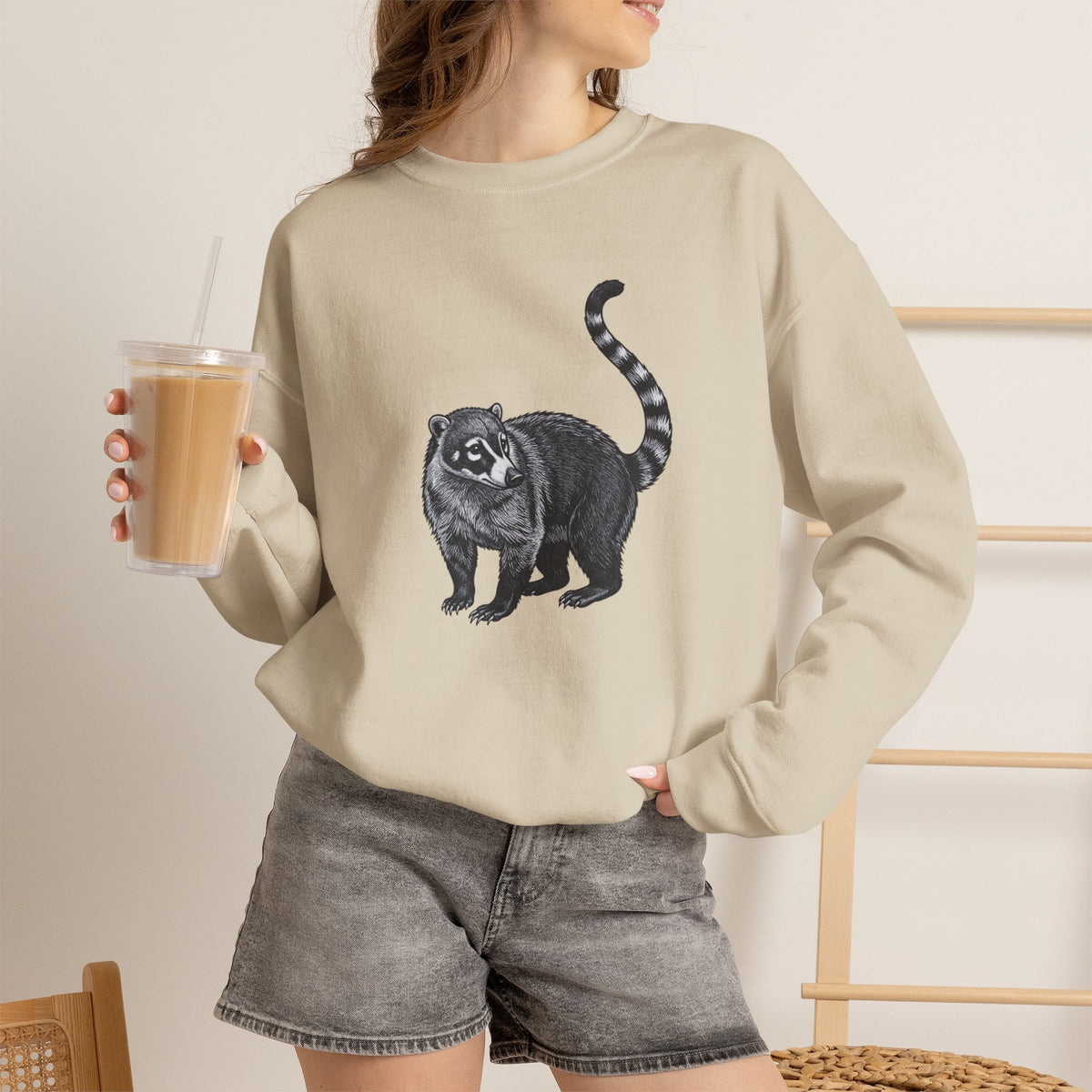 Coati graphic sweatshirt from Wyldelife Collection featuring wildlife art, with a cozy fit and detailed coati illustration.
