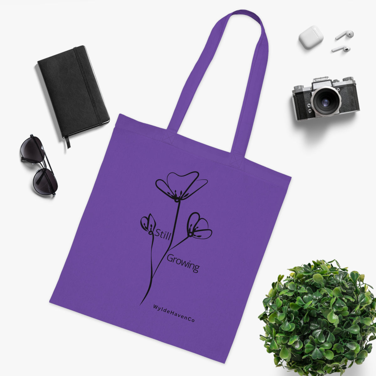 Still Growing floral cotton tote bag by Printify featuring a minimalist design with inspiring floral artwork.