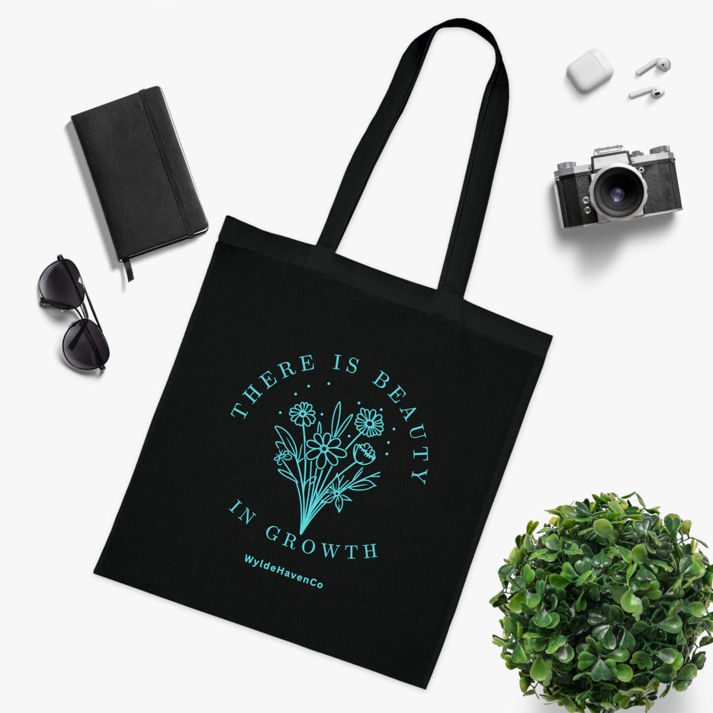 Floral cotton tote bag with "There Is Beauty In Growth" inspirational message, eco-friendly design by Printify.