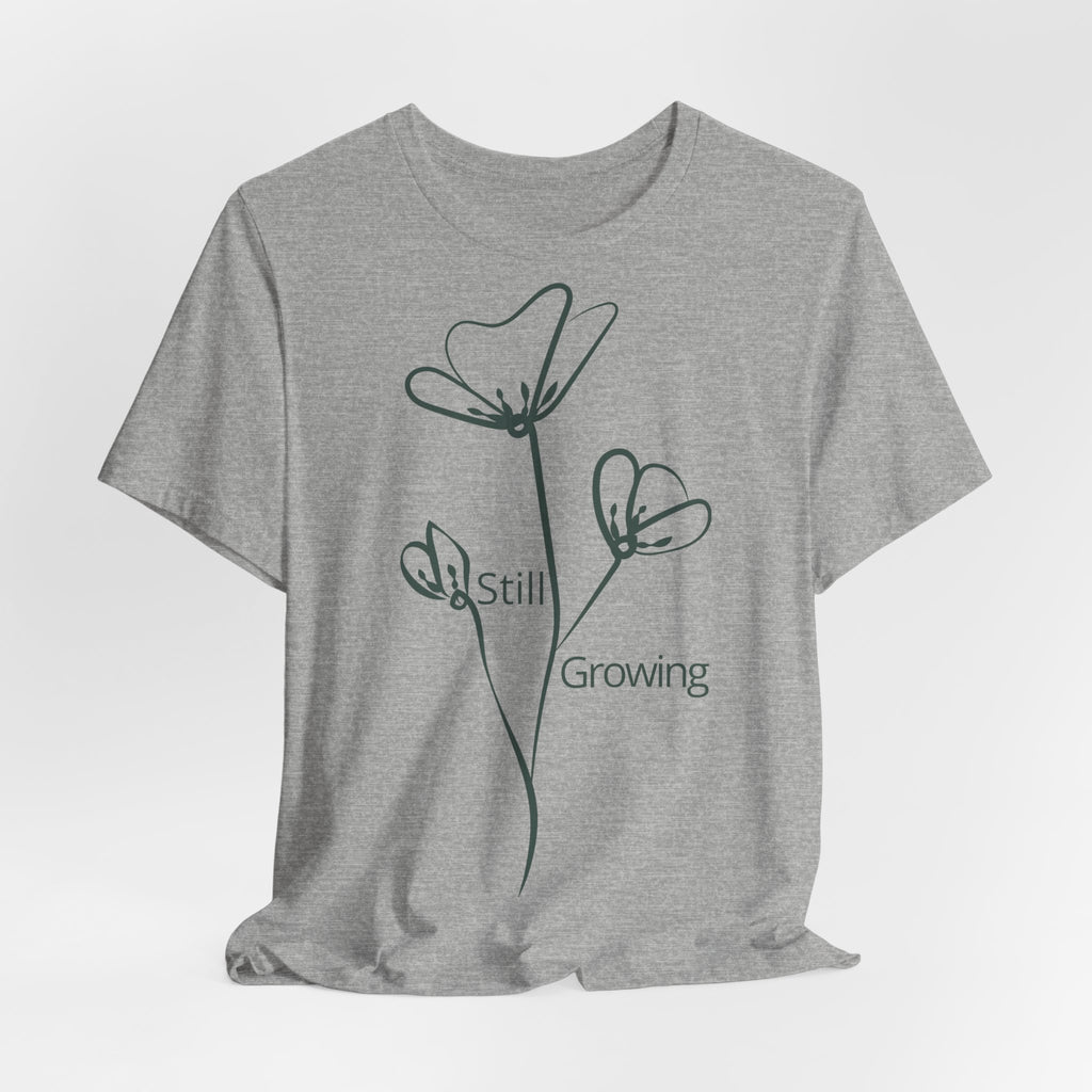 Still Growing Floral T-Shirt by Printify featuring minimalist floral design on a casual T-shirt for everyday wear.