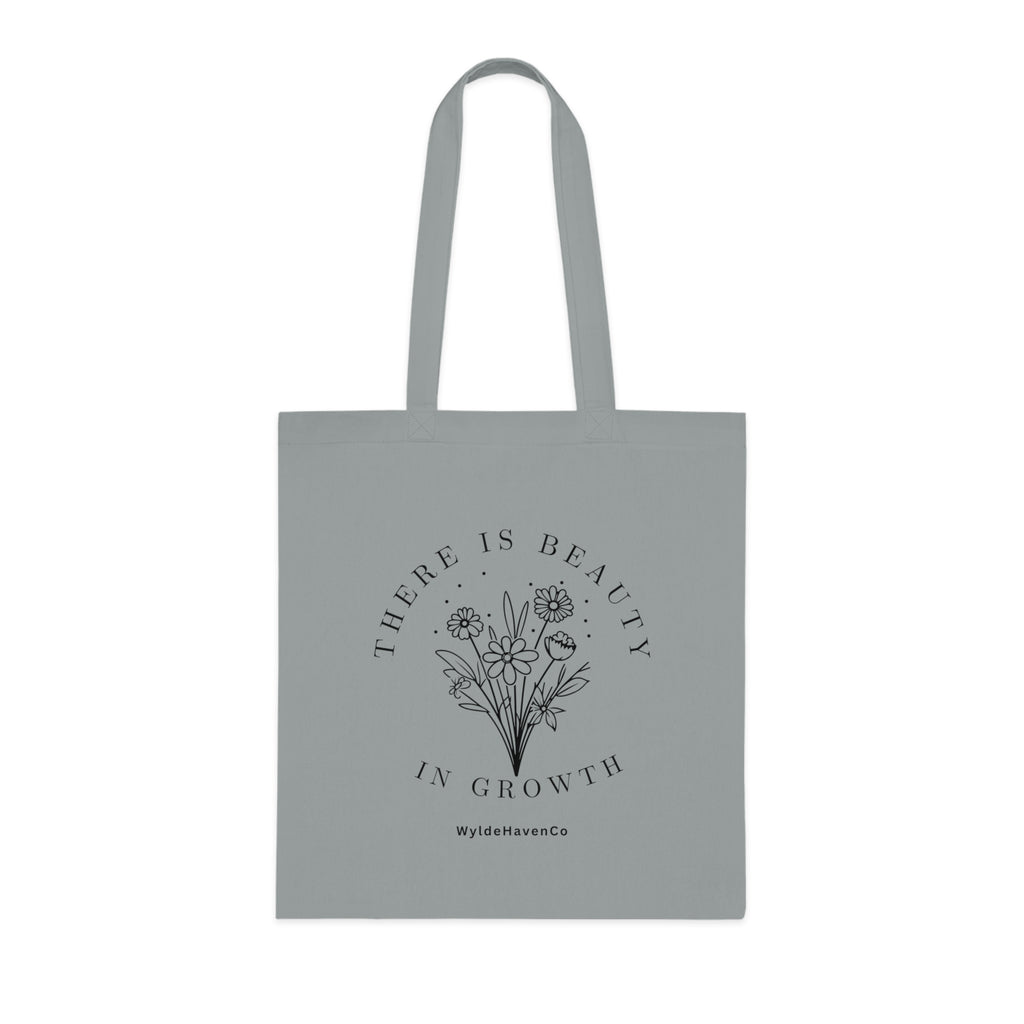 Floral cotton tote bag with "There Is Beauty In Growth" text, eco-friendly bag by Printify with natural floral design.