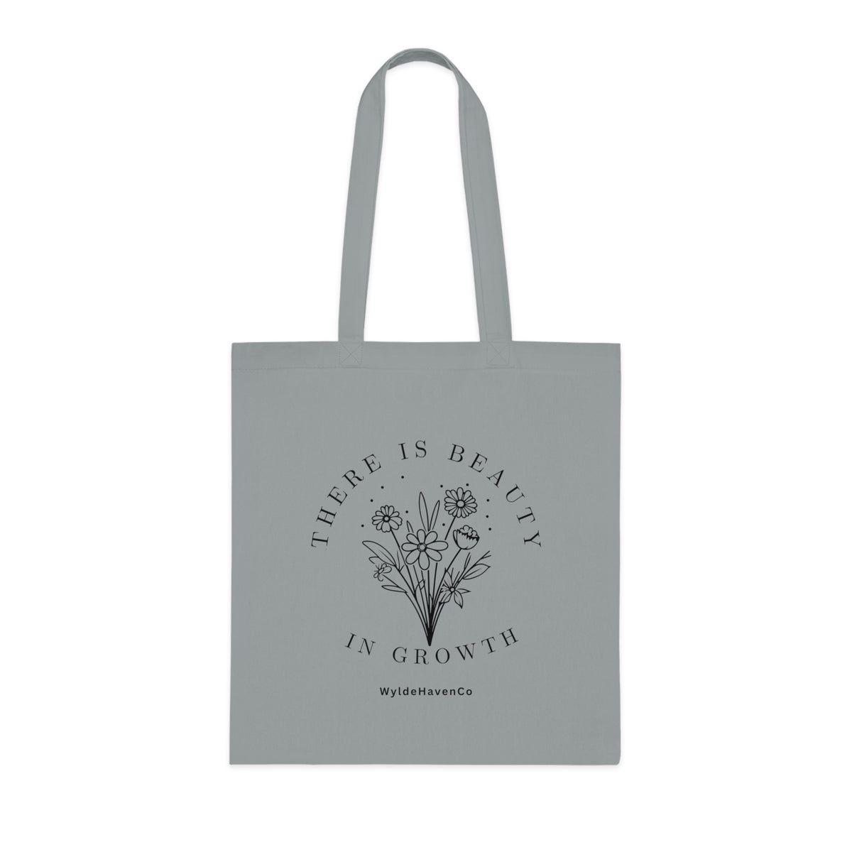 Floral cotton tote bag with "There Is Beauty In Growth" text, eco-friendly bag by Printify with natural floral design.