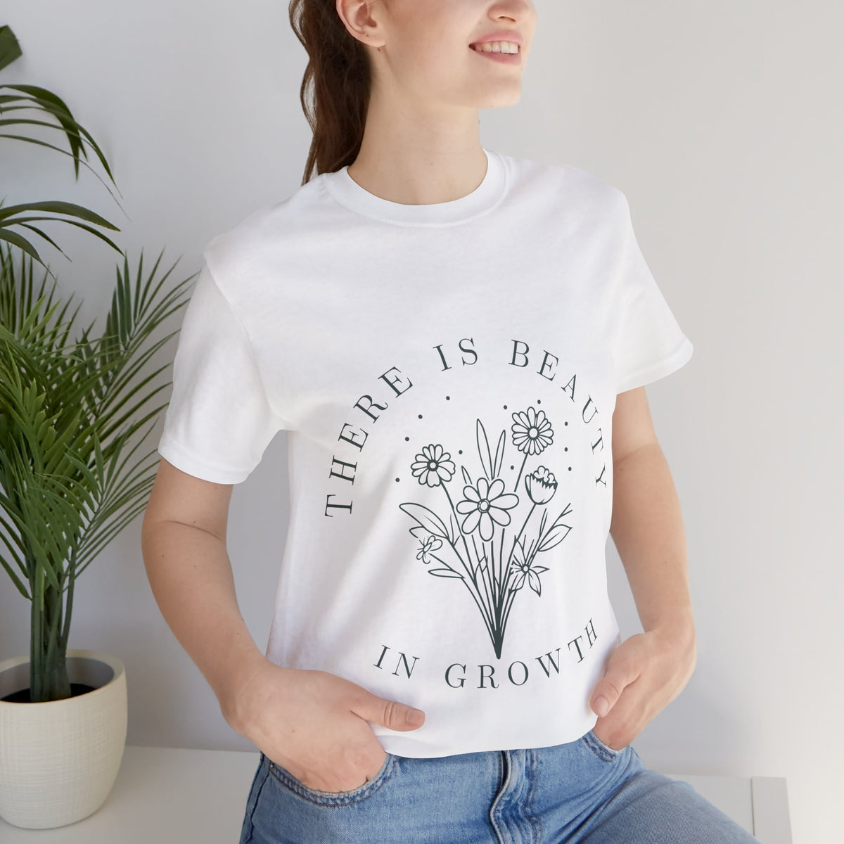 Printify floral T-shirt featuring a colorful "There Is Beauty In Growth" design on soft fabric.