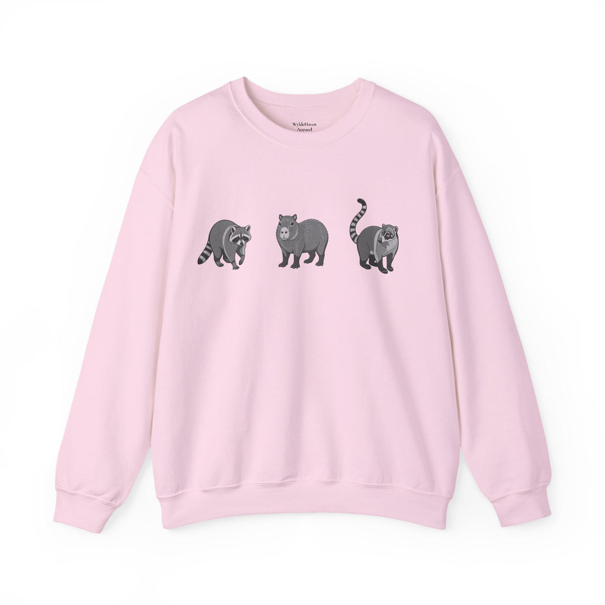 Wildlife Trio graphic sweatshirt featuring raccoon, capybara, and coati designs from Wyldelife Collection by Printify.