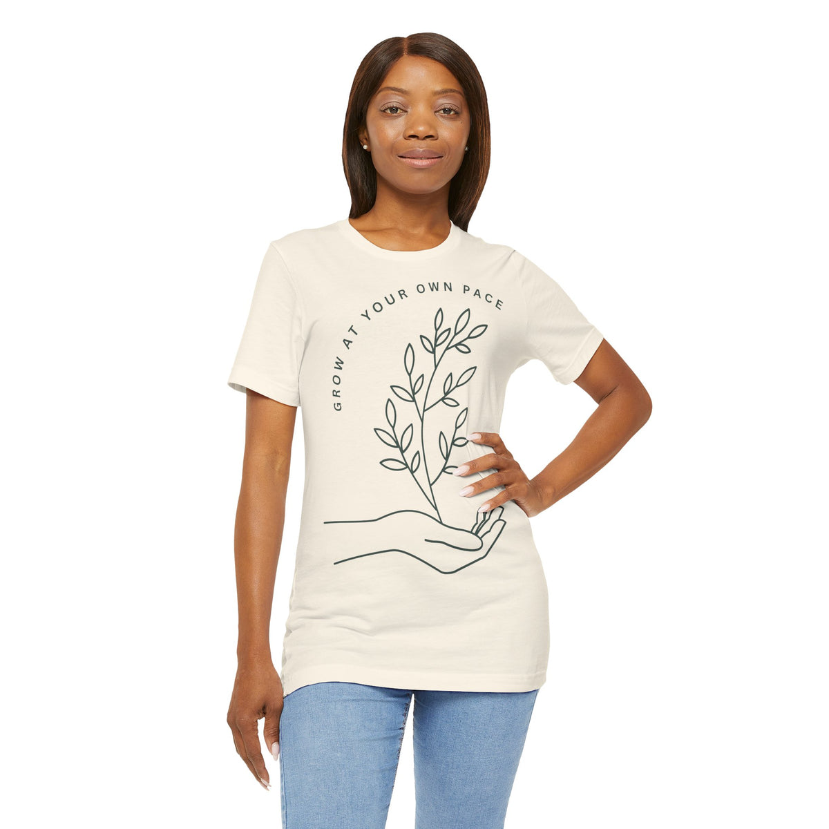 Minimal botanical print T-shirt from Printify with "Grow At Your Own Pace" slogan, featuring a simple plant design.