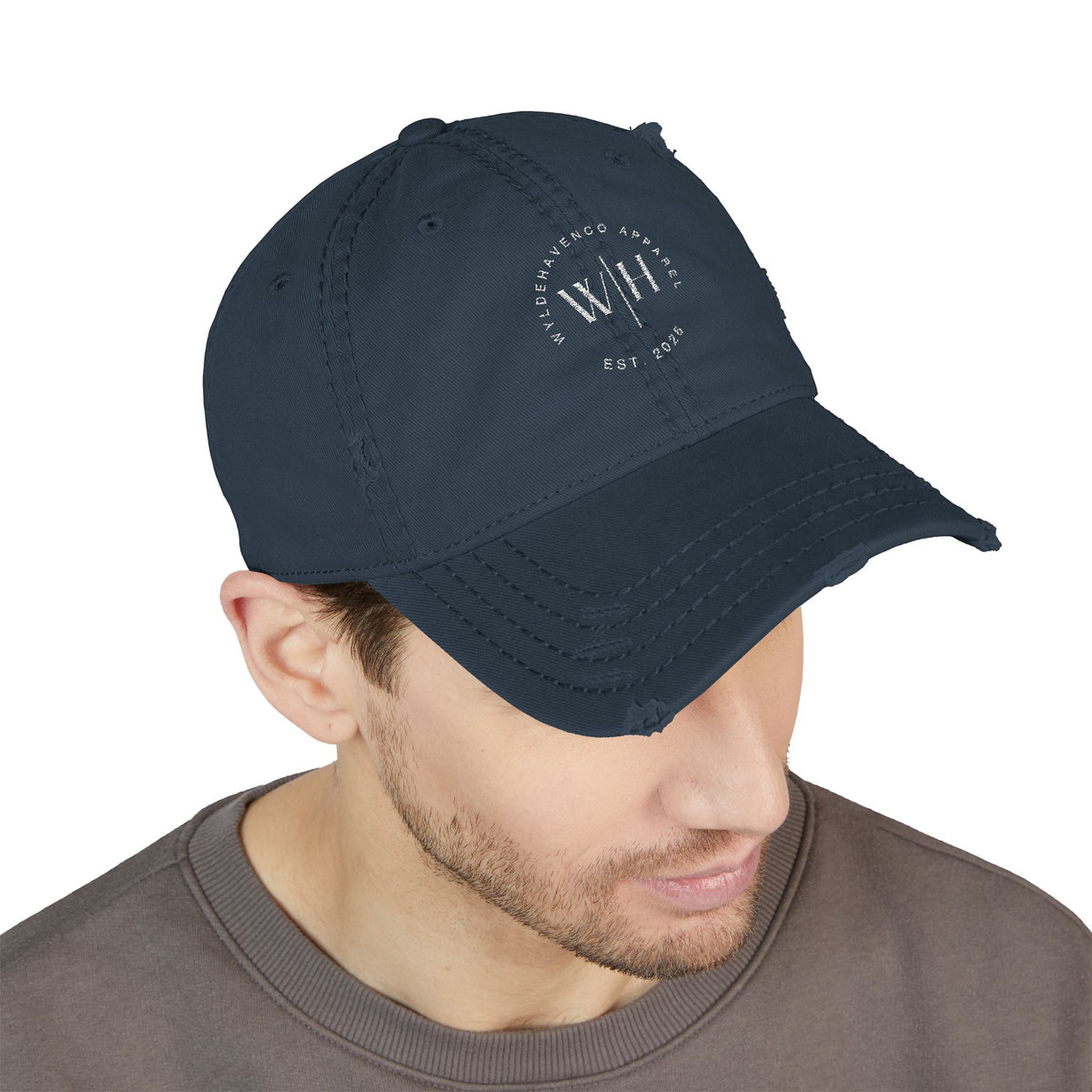 Distressed embroidered dad hat with vintage washed finish, casual baseball cap style from Printify, showing front embroidery and distressed fabric.