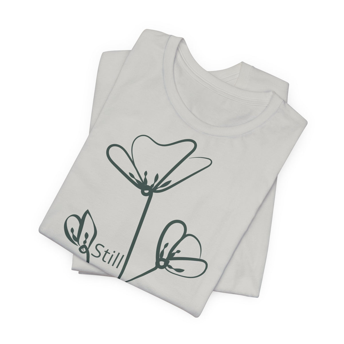 Still Growing floral T-shirt by Printify featuring minimalist inspirational design, casual fit, and vibrant floral artwork.