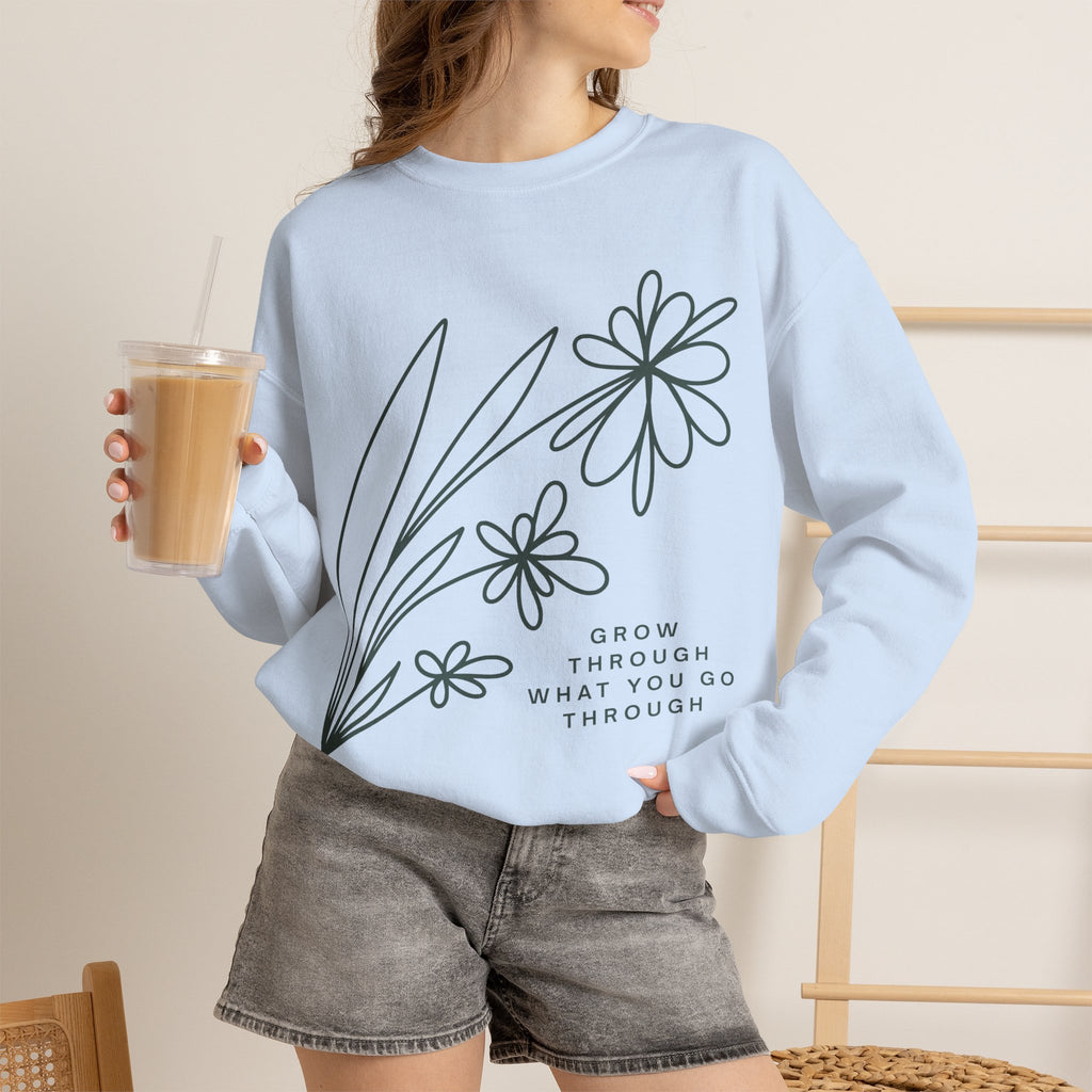 Printify crewneck sweatshirt with floral design and inspirational quote "Grow Through What You Go Through" on soft, comfortable fabric.