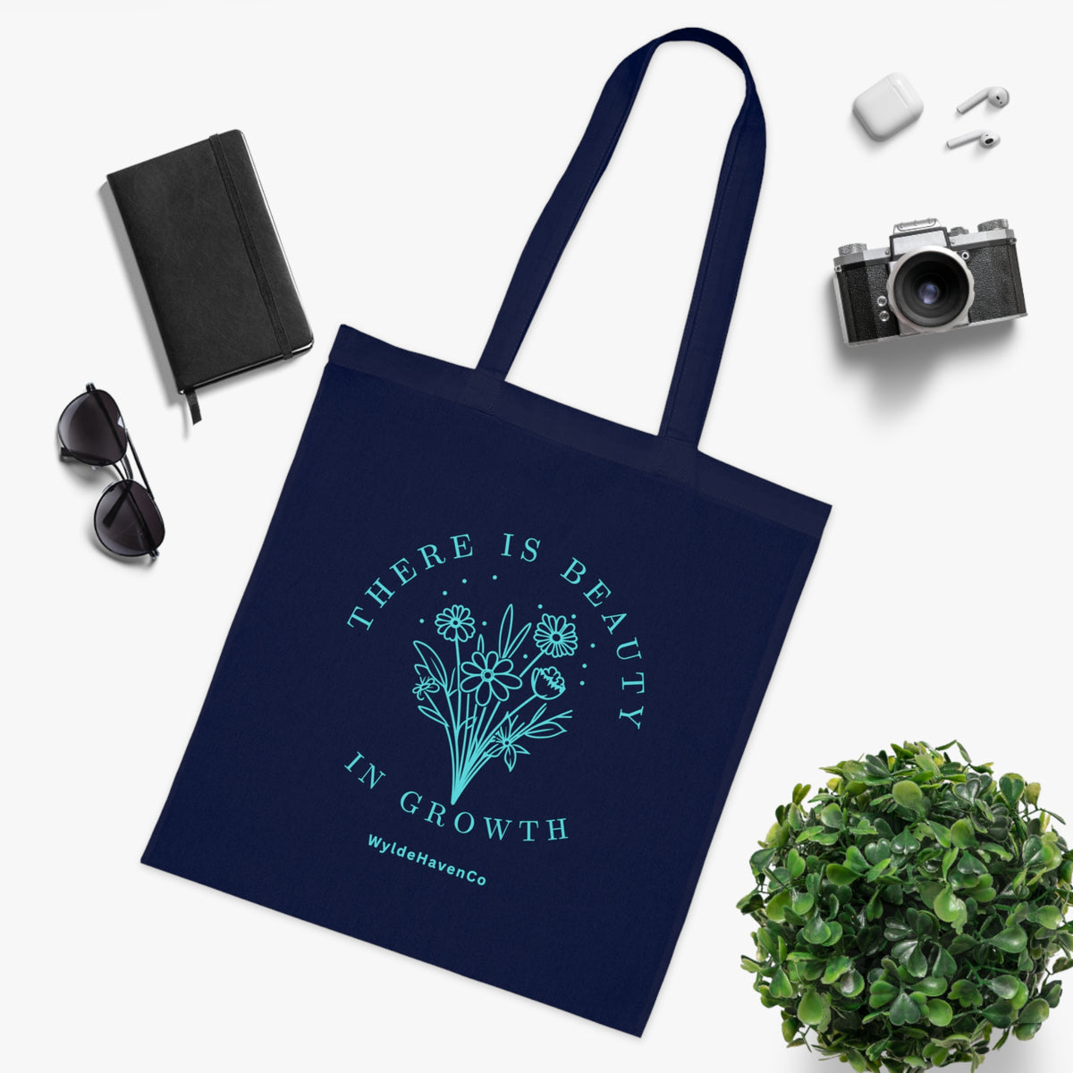 Floral cotton tote bag with "There Is Beauty In Growth" inspirational message, eco-friendly reusable bag by Printify.