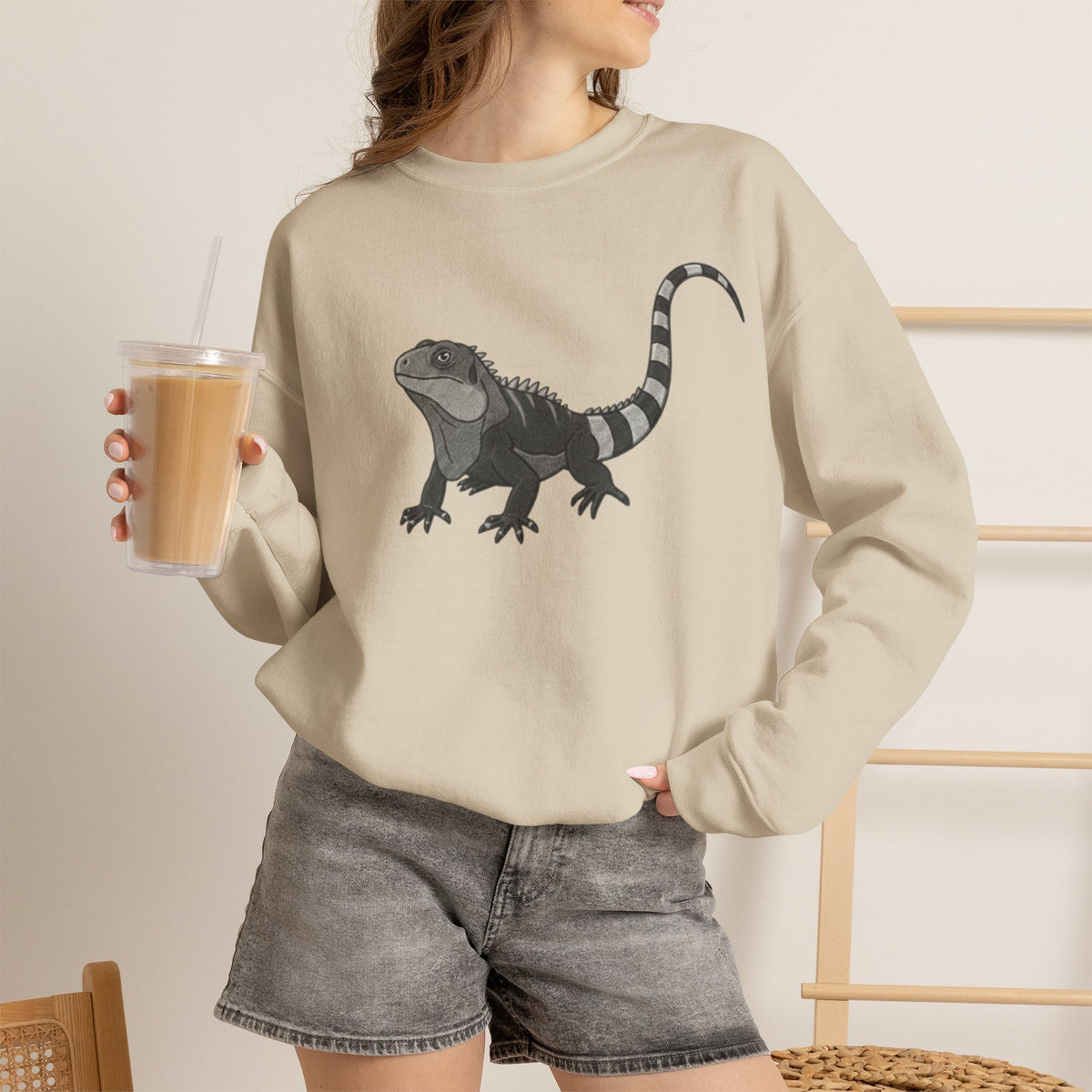 Iguana graphic sweatshirt from Wyldelife Collection by Printify featuring an original wildlife art design on a comfortable sweatshirt.