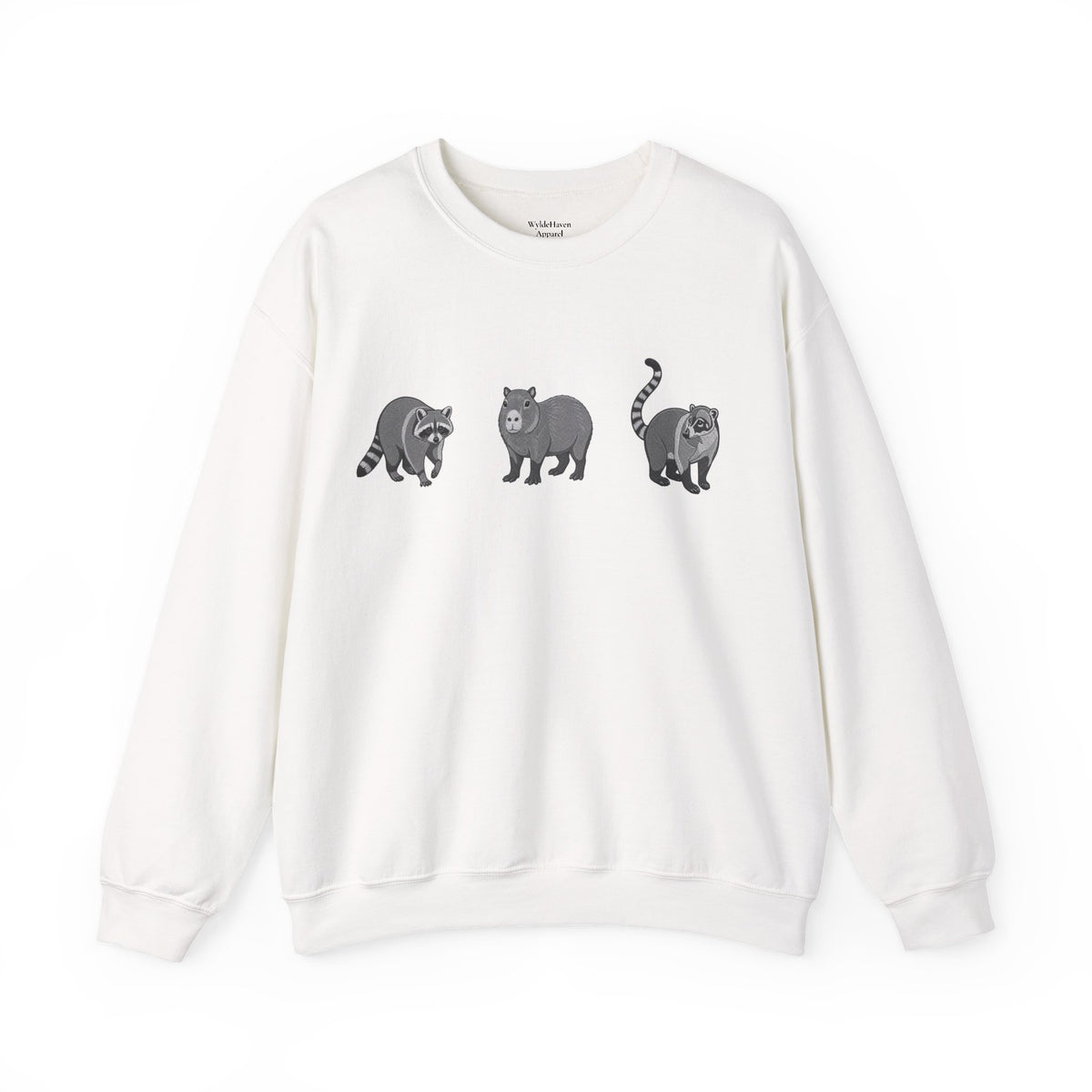 Wildlife Trio graphic sweatshirt featuring raccoon, capybara, and coati images from Wyldelife Collection by Printify