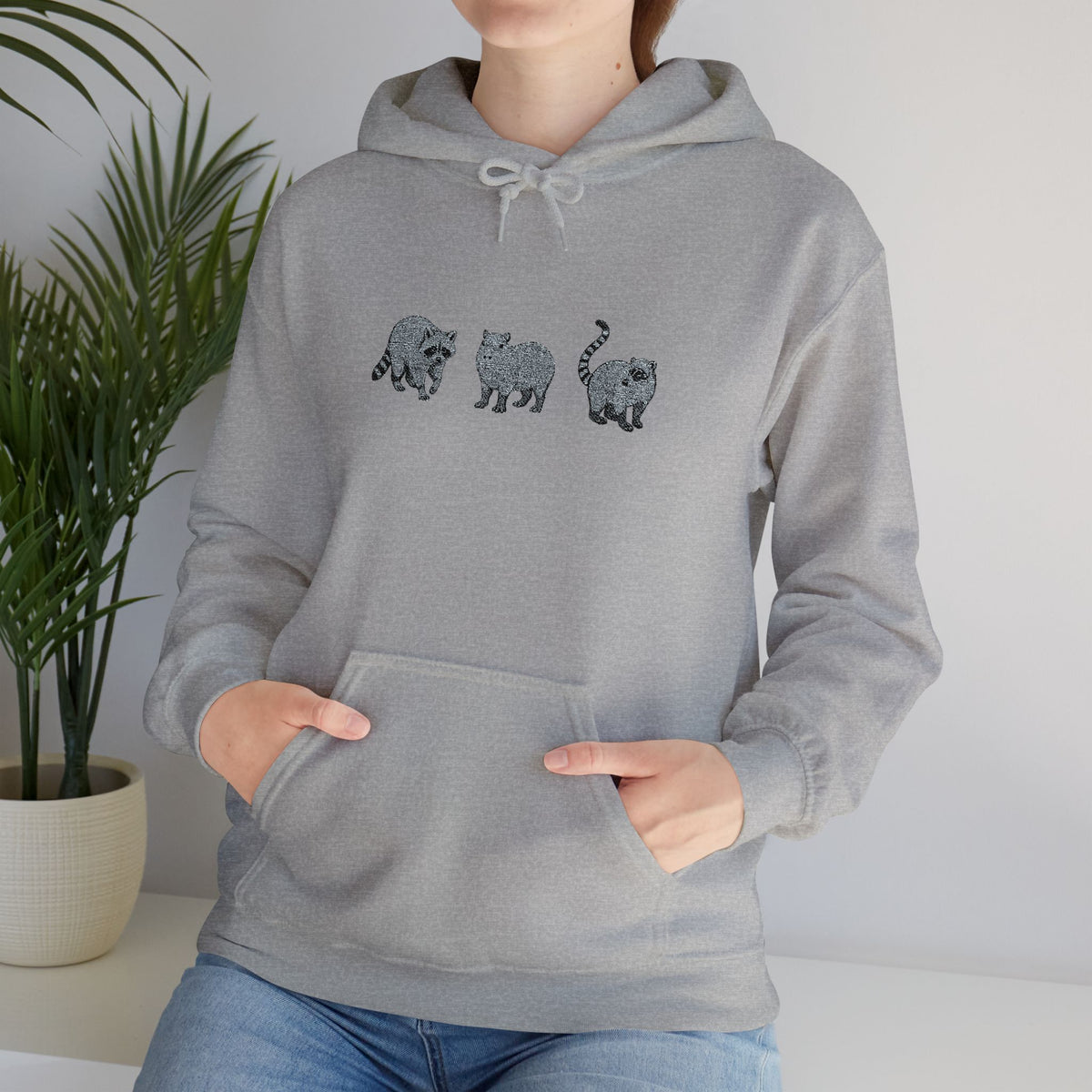 Wyldelife Trio embroidered hoodie by Printify featuring raccoon, capybara, and coati designs on a cozy hoodie.
